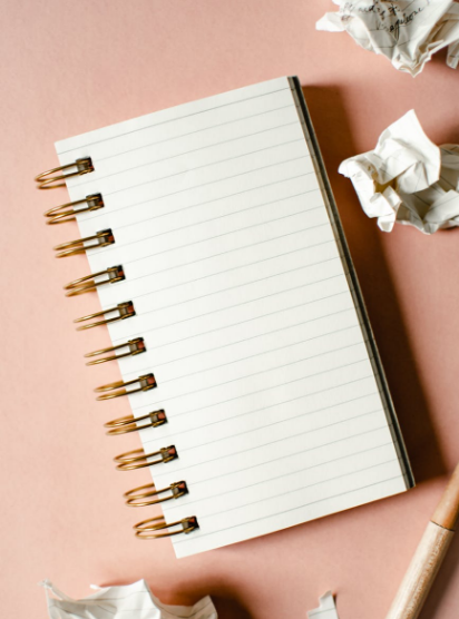 Photo from Unsplash which has a paper ball and a dairy 